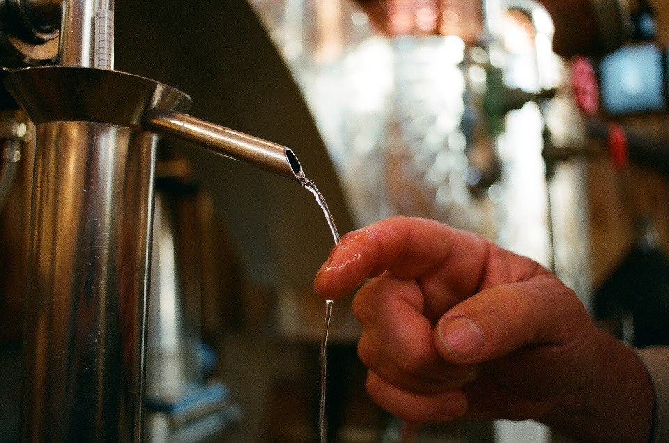 Image of Cap Rock gin pouring from a still